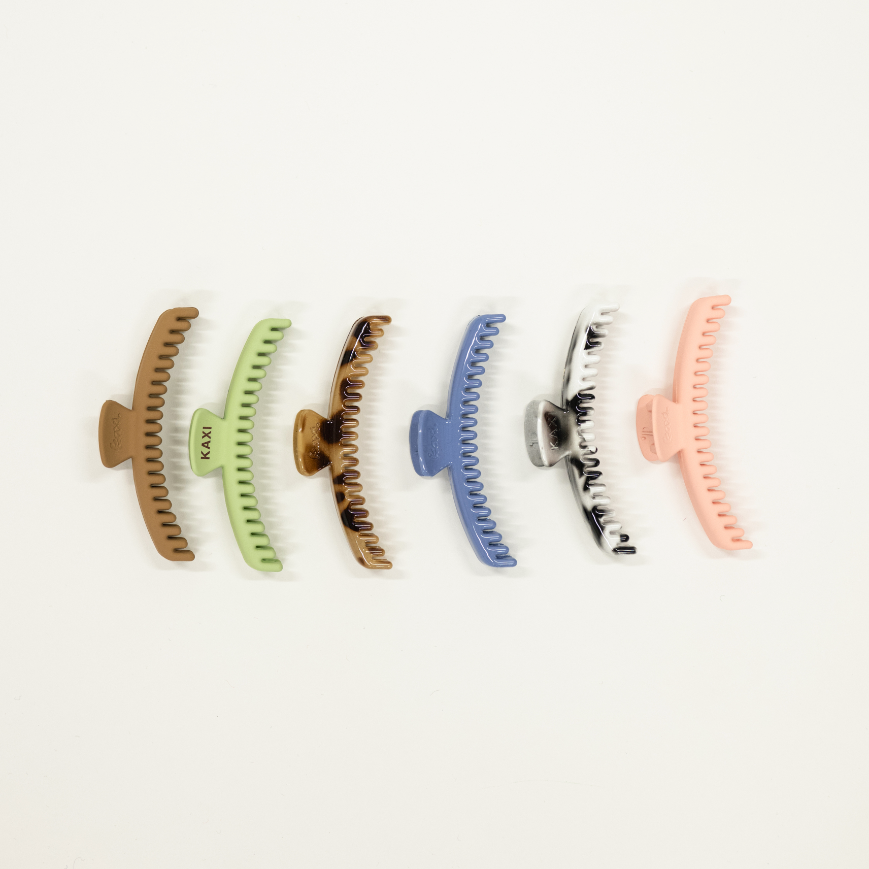 collection of midi sized kaxi hold everything hair claw