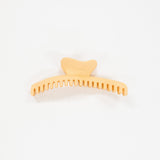 honey orange hair comb on a white background