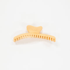 honey orange hair comb on a white background