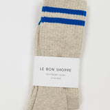 Beige sock with blue stripes on a white background, featuring 'Le Bon Shoppe' branding.