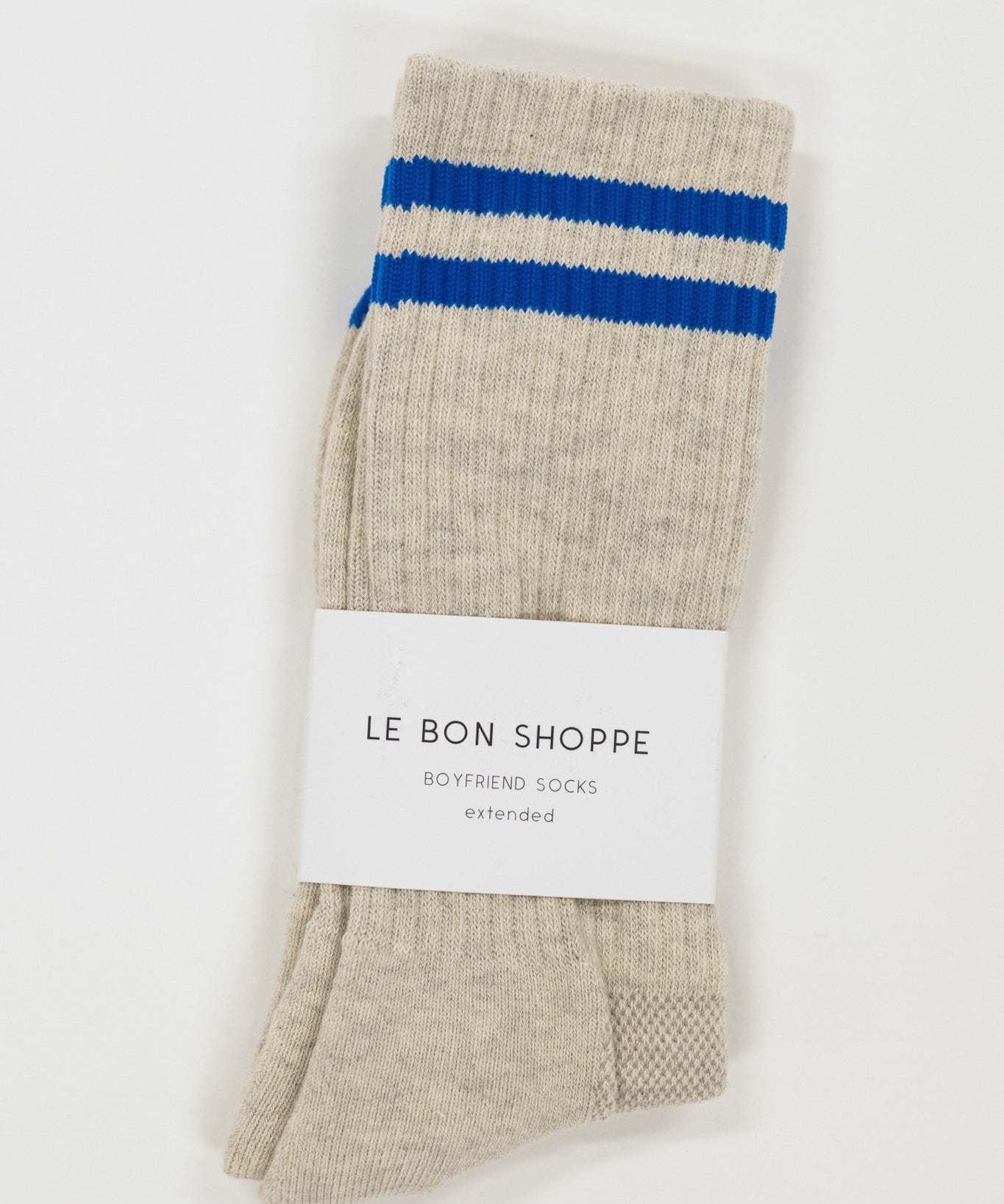 Beige sock with blue stripes on a white background, featuring 'Le Bon Shoppe' branding.