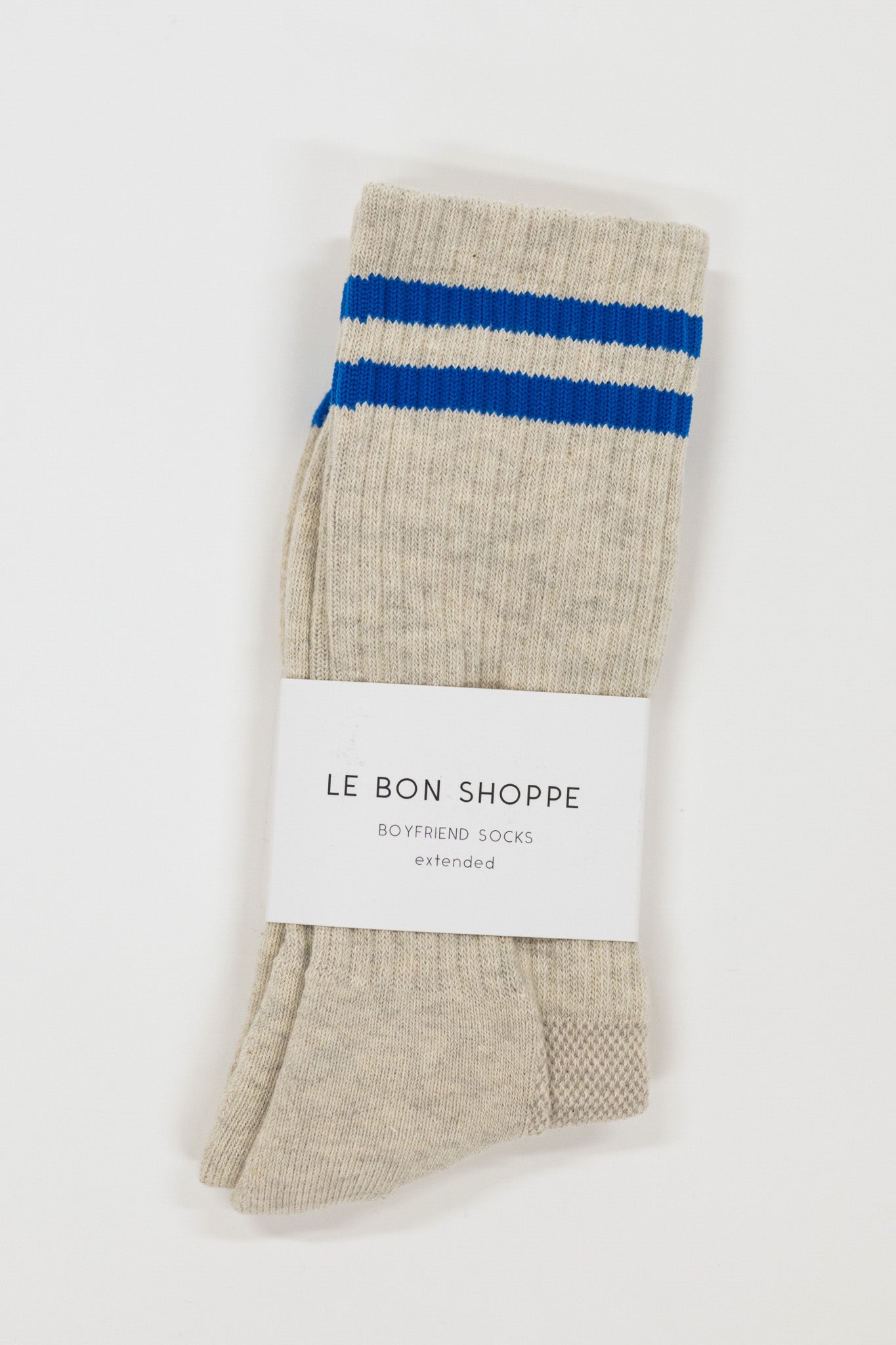 Beige sock with blue stripes on a white background, featuring 'Le Bon Shoppe' branding.
