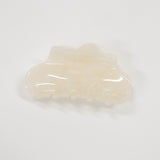 A translucent cream-colored hair claw clip with a glossy finish, photographed on a seamless white background.
