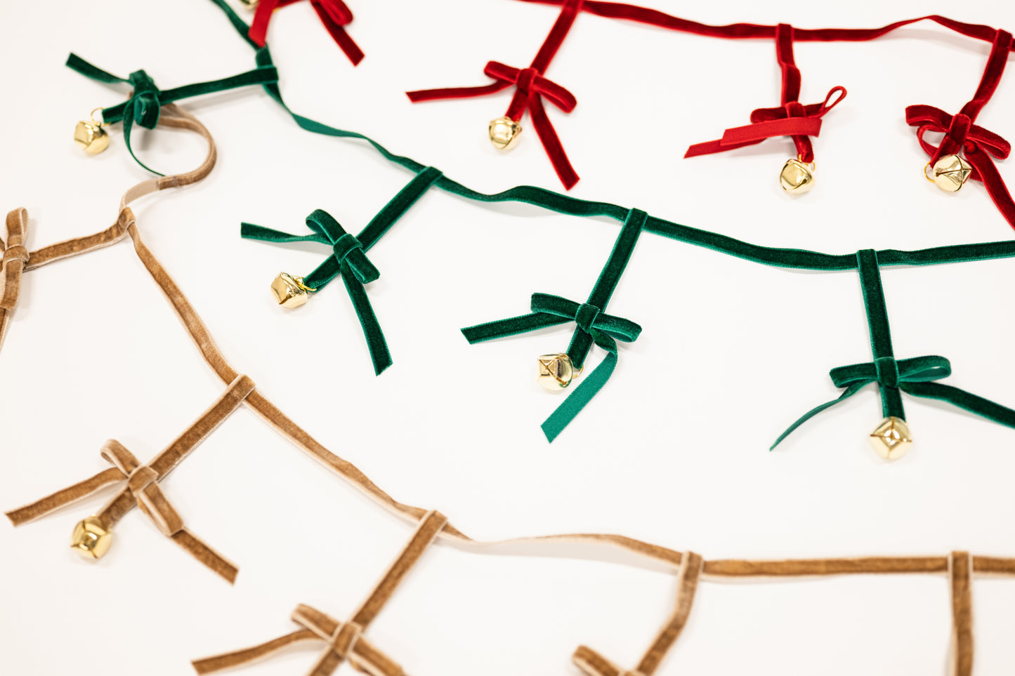 taupe green and red bow garland with jingle bells