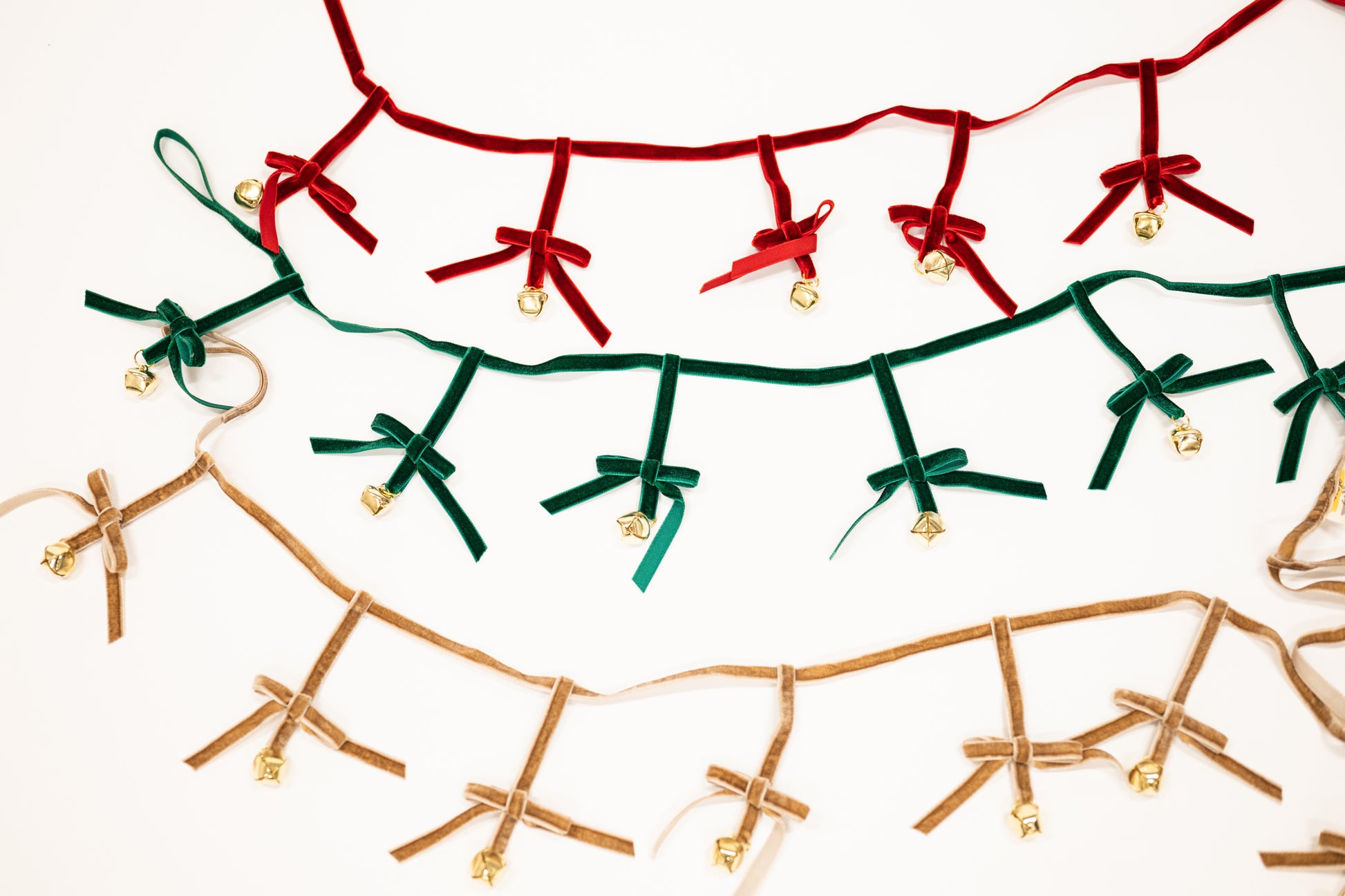 taupe green and red bow garland with jingle bells