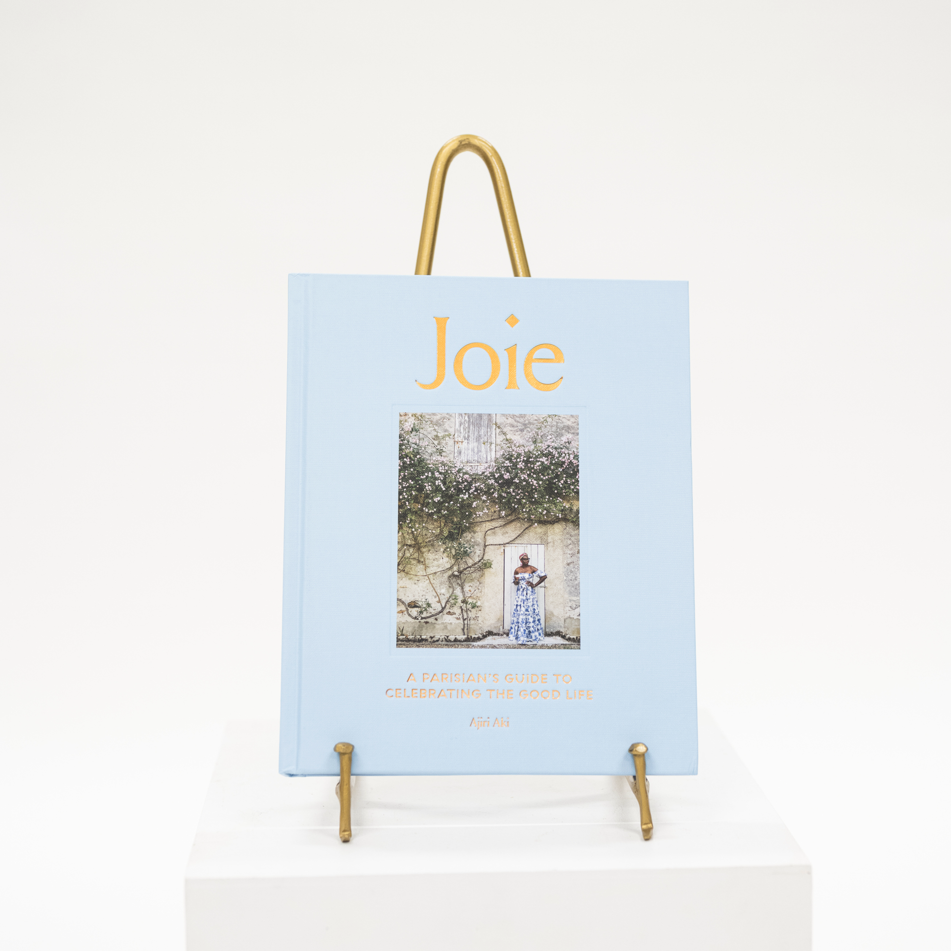 joie blue linen coffee table book about parisian lifestyle