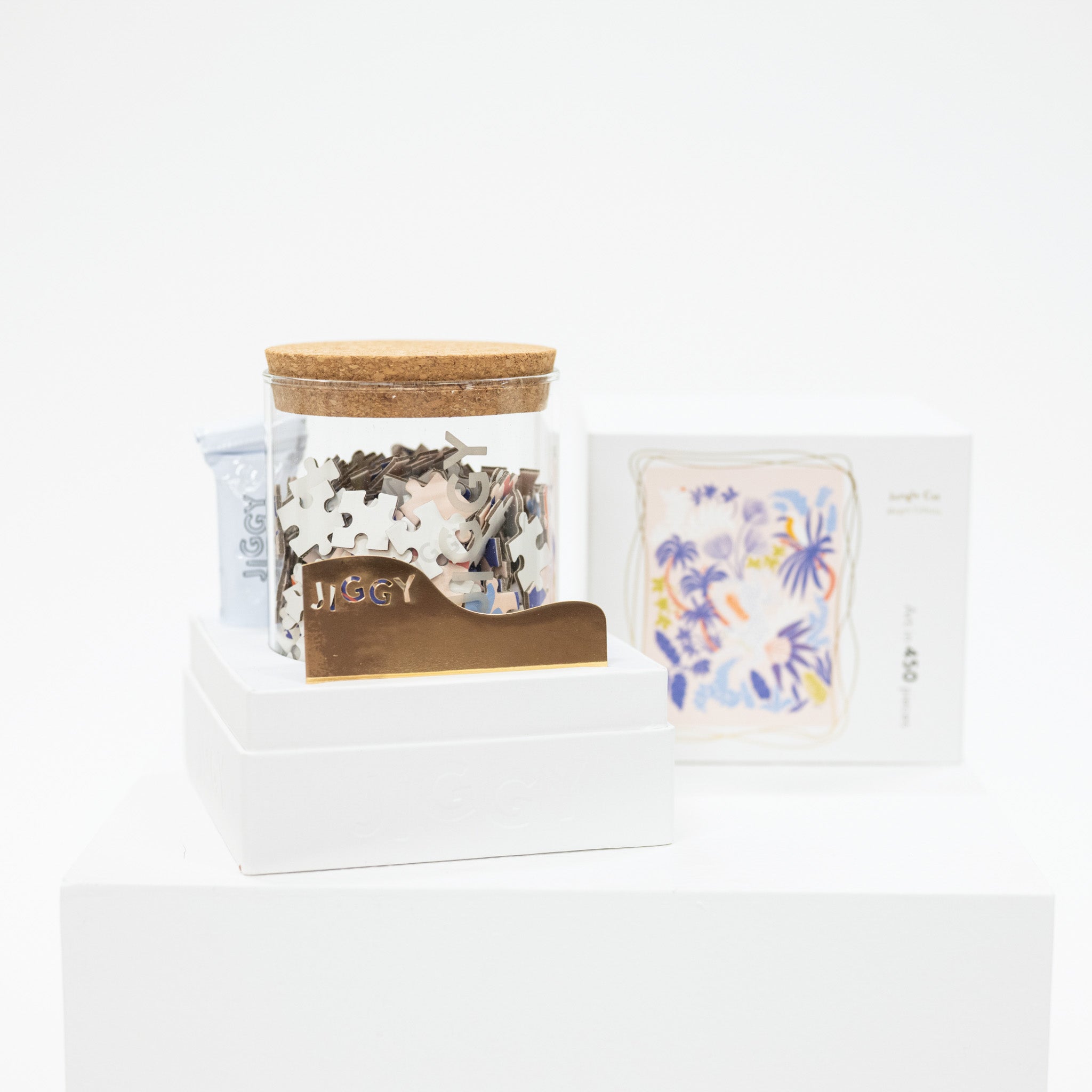 Jar of puzzle with a wooden lid on a white background
