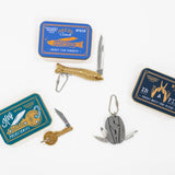 Collection of small tools and keychains on a white background