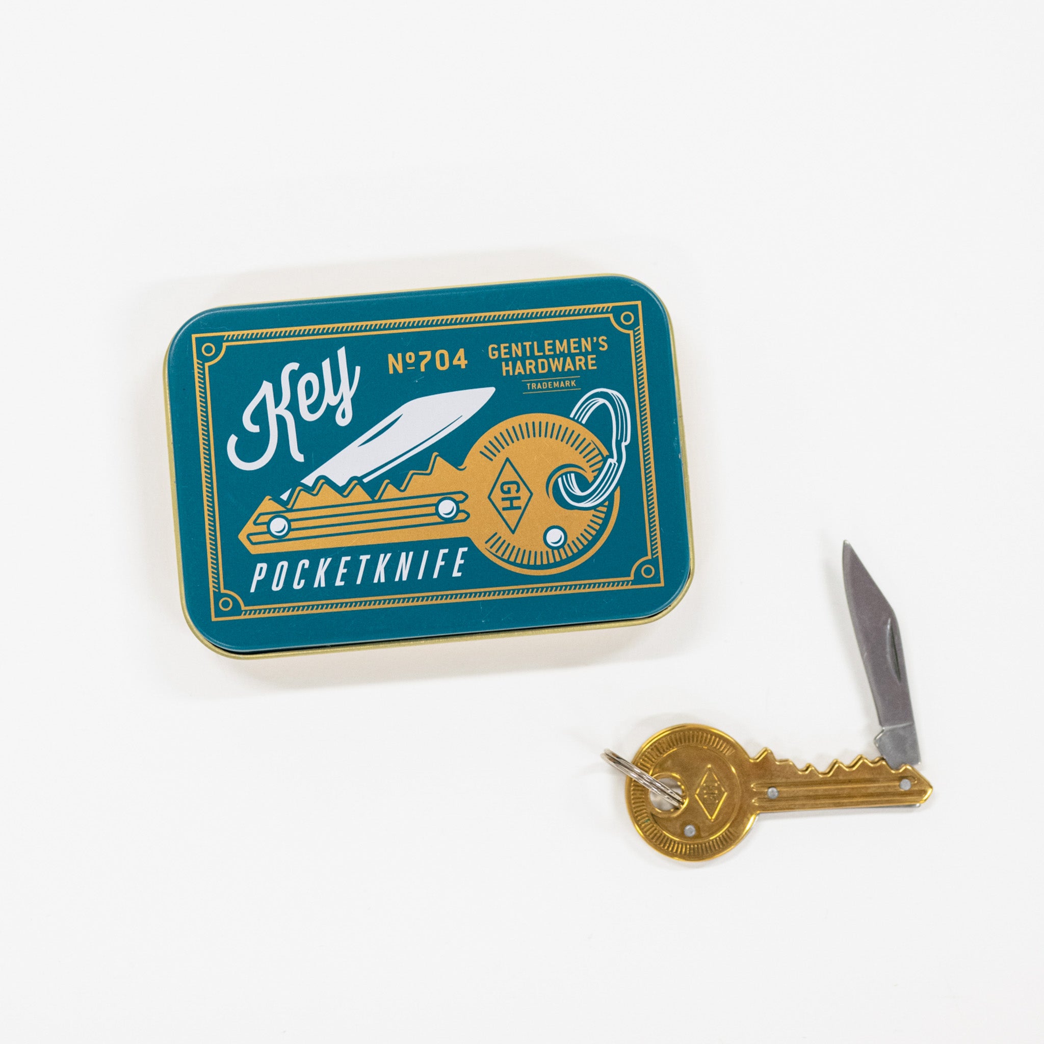 Pocket knife with key attachment and branded tin on a white background
