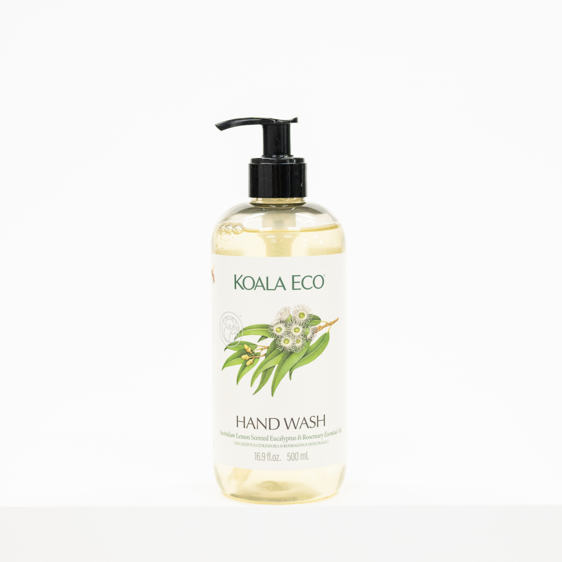 A bottle of Koala Eco Hand Wash with a black pump dispenser and a white label featuring green leaves and white flowers, set against a plain white background.