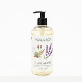 A bottle of KOALA ECO Hand Wash with a black pump dispenser and a white label featuring botanical illustrations of lavender, rose, and herbs, set against a plain white background.