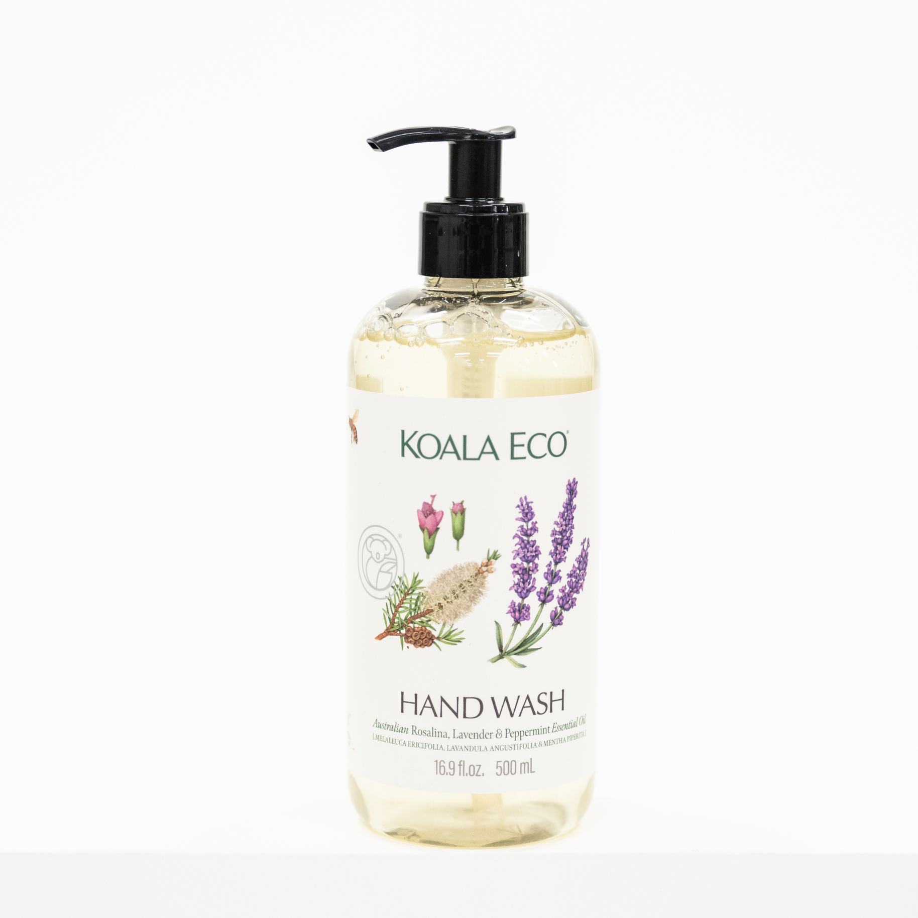 A bottle of KOALA ECO Hand Wash with a black pump dispenser and a white label featuring botanical illustrations of lavender, rose, and herbs, set against a plain white background.