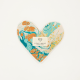 Heart-shaped decorative item with marbled design and 'LOVE MERT' label on a white background