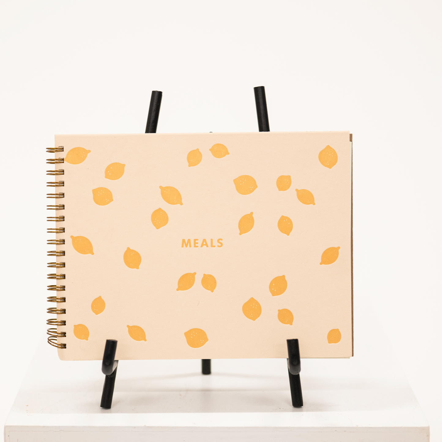 meal planner notebook with yellow lemons