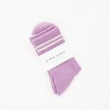 light purple crew boyfriend style sock with white stripes and a white label saying le bon shoppe.