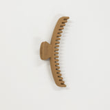 Brown hair claw on a white background