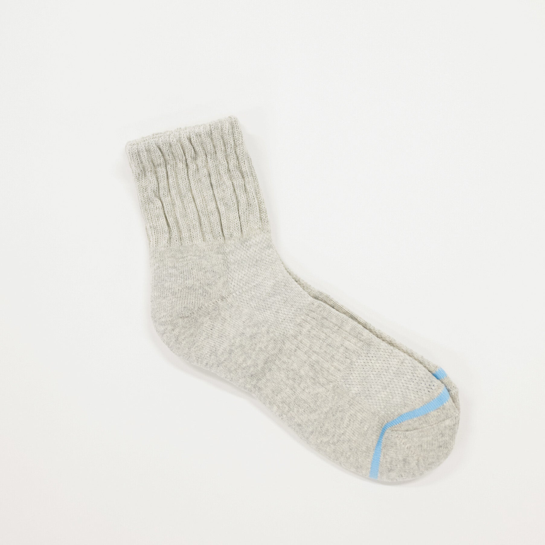 A light gray ribbed knit sock with a light blue accent stripe near the toe, displayed on a clean white background.