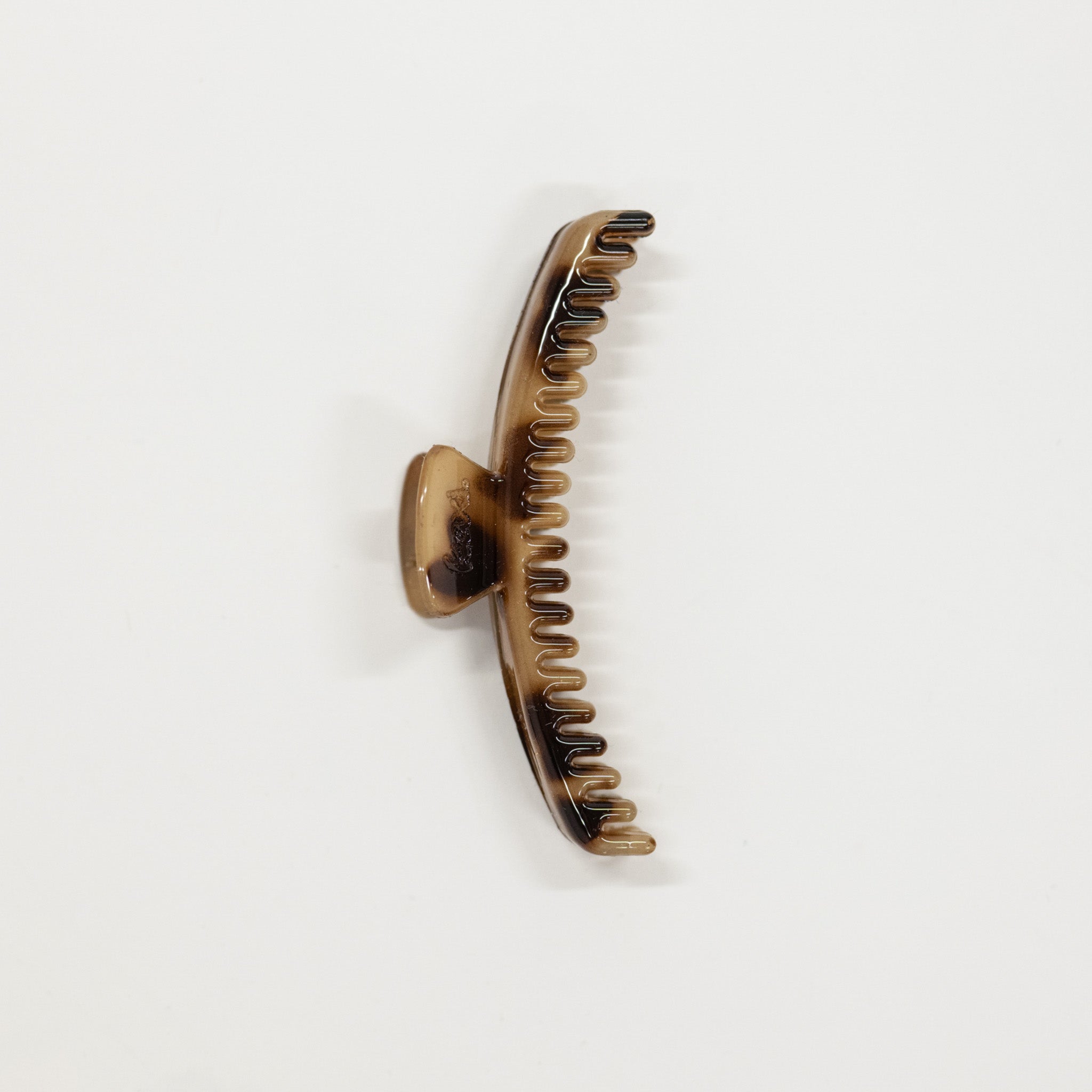 tortise hair claw on a white background