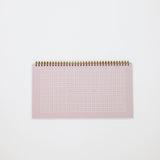 Lilac desk calendar with grid on a white background