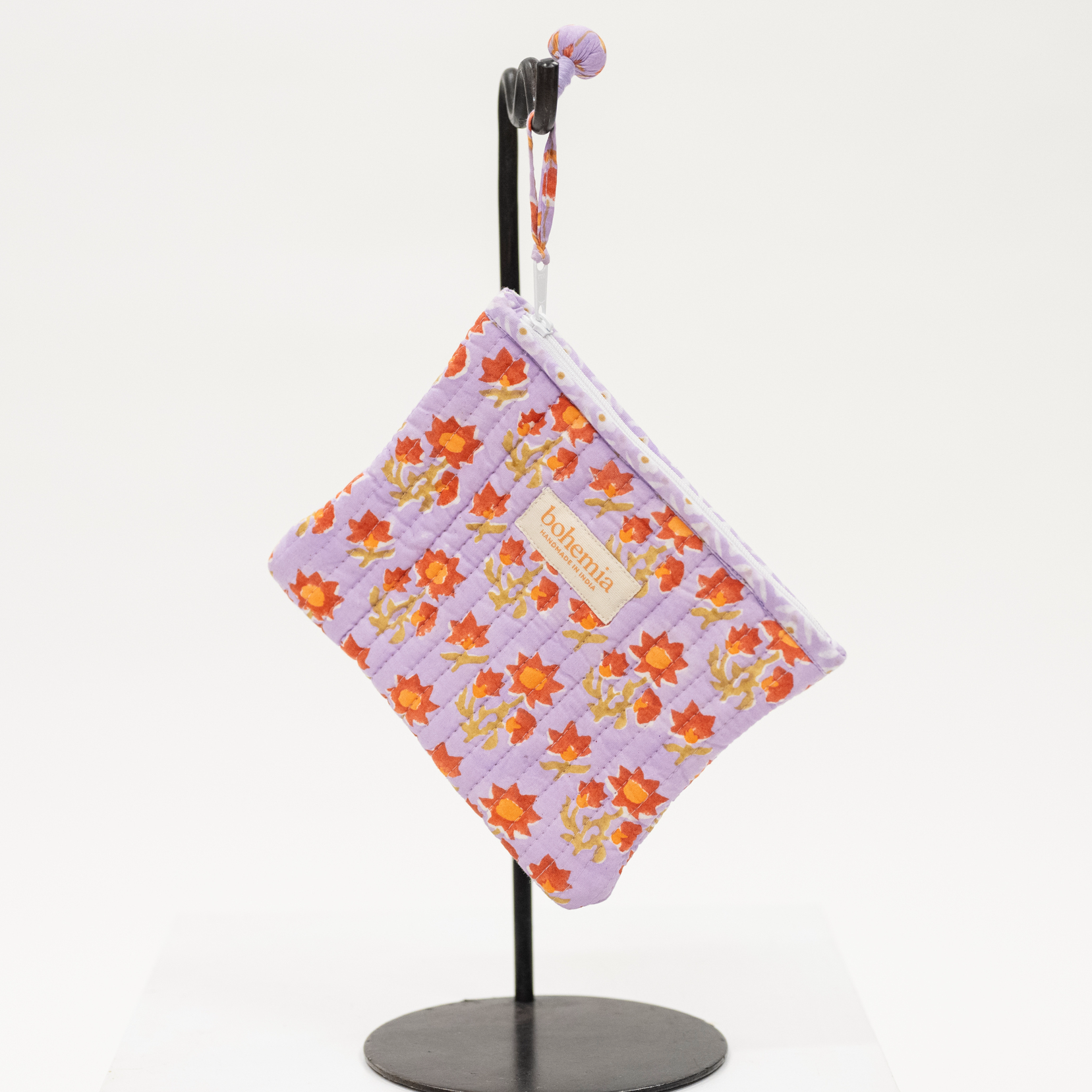 Quilted block printed zip pouch for organization