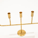 golden candelabra with five linear arms