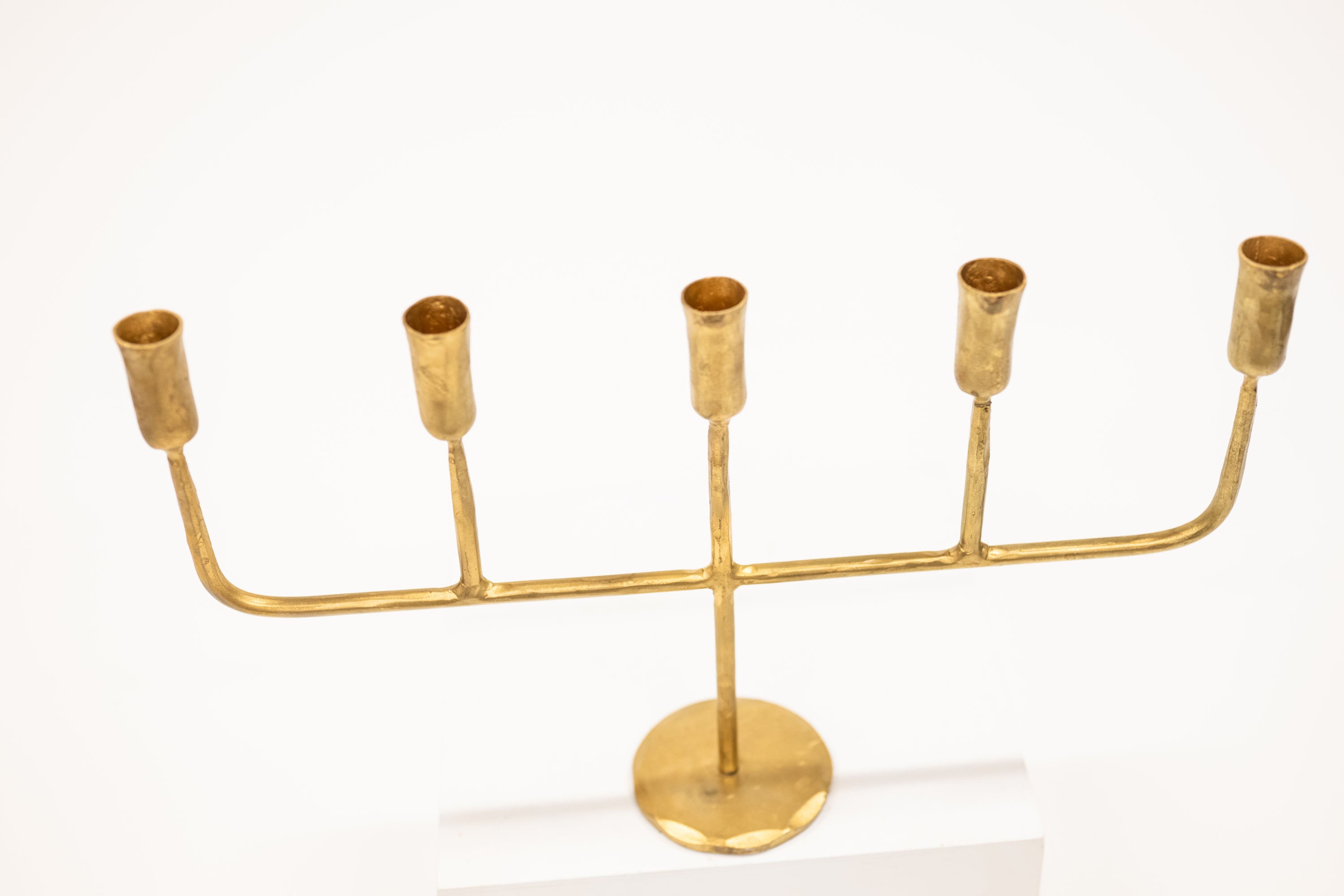 golden candelabra with five linear arms