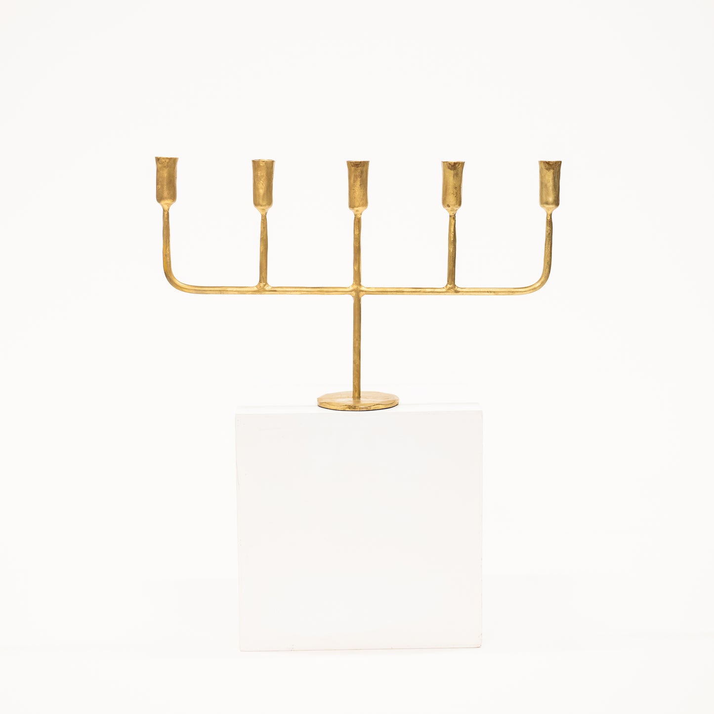 golden candelabra with five linear arms
