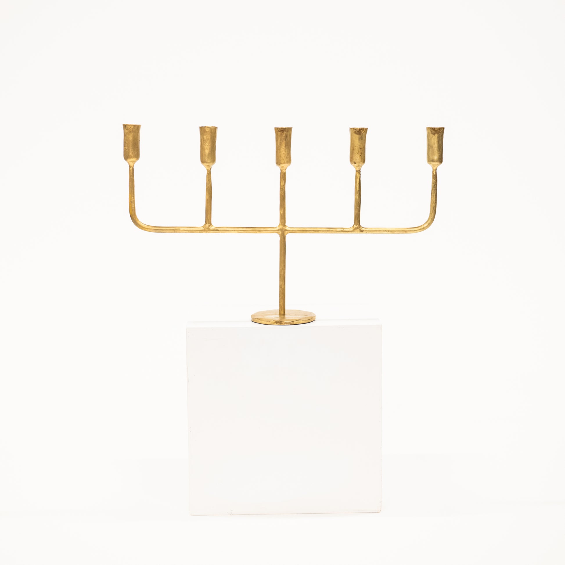 golden candelabra with five linear arms