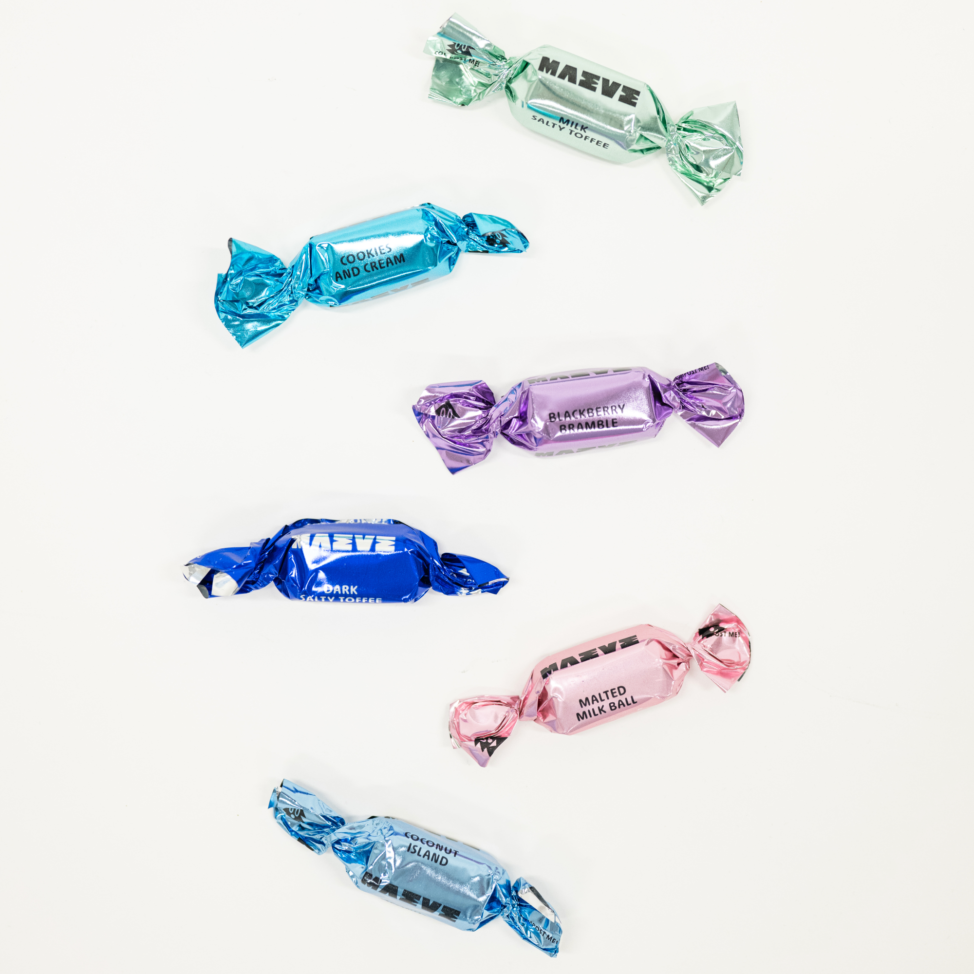 Colorful chocolate candies with visible brand names on a white background