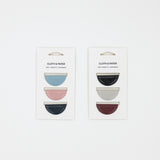 Two packages of 'Cloth & Paper' magnetic bookmarks with colorful designs on a white background.