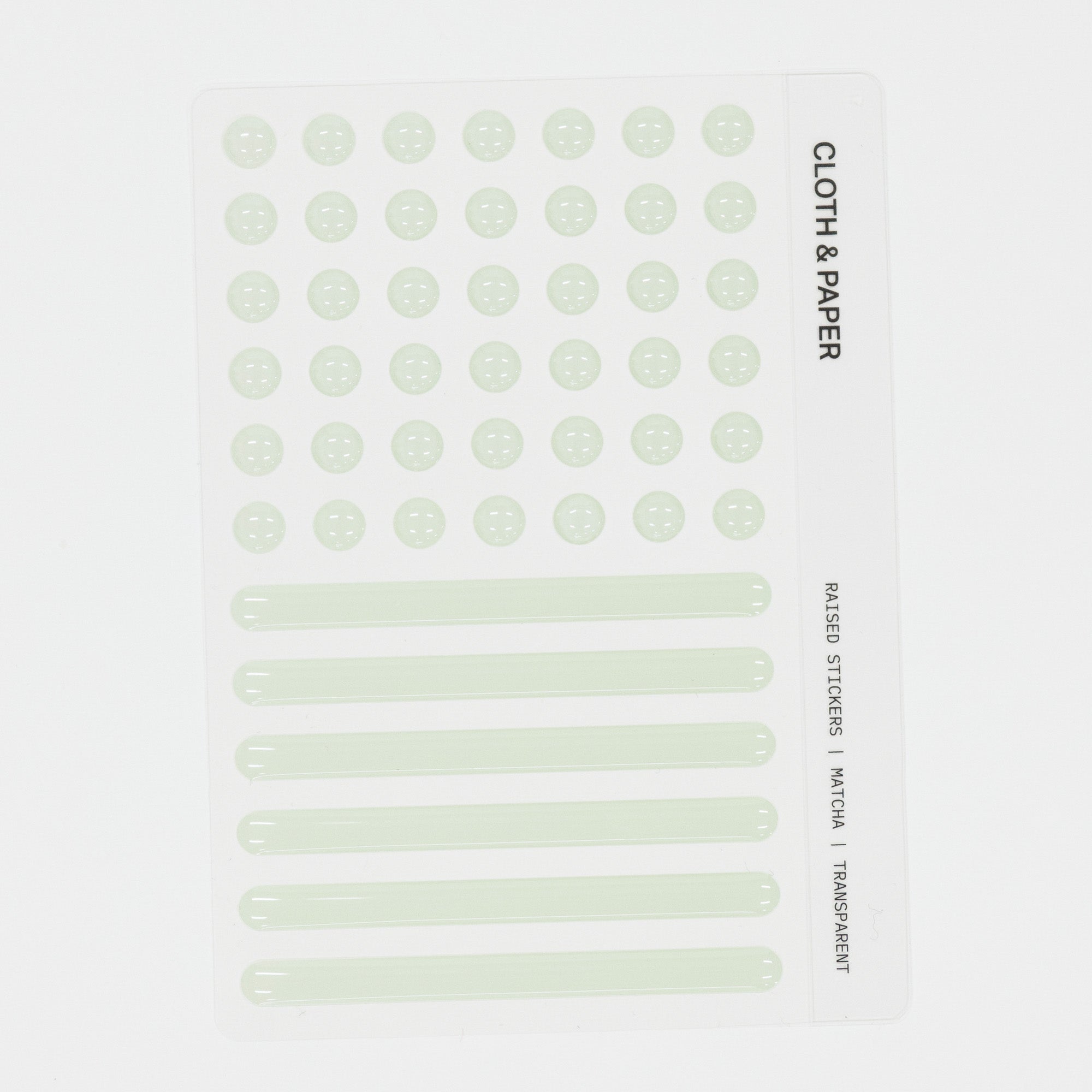 Sheet of green raised stickers with text on a white background