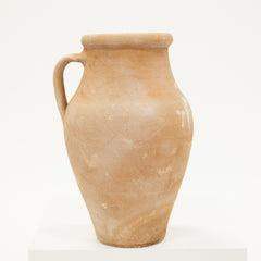 Terracotta pitcher on a white background