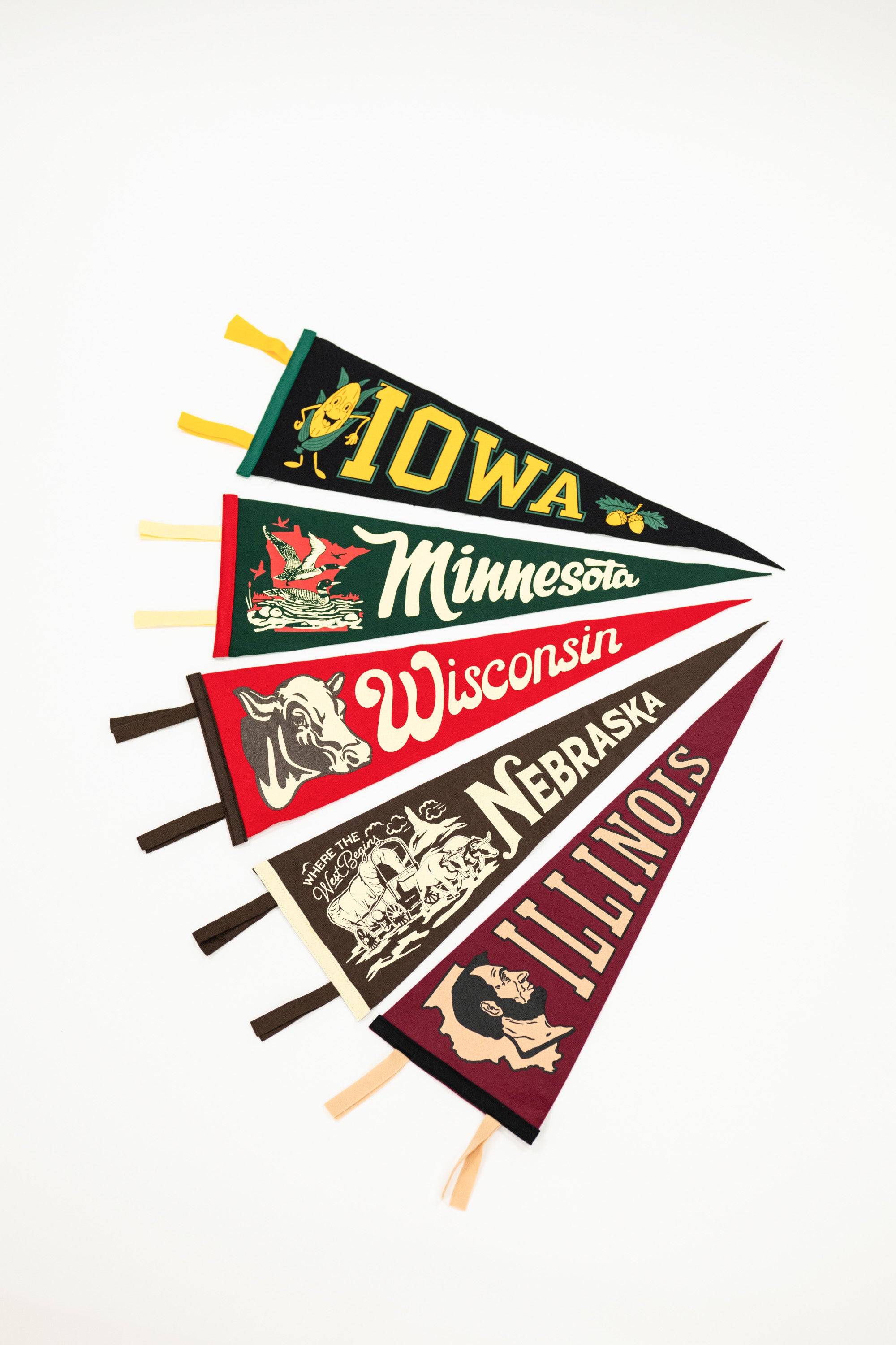 Set of vintage-style state pennants from Iowa, Minnesota, Wisconsin, Nebraska, and Illinois on a white background.