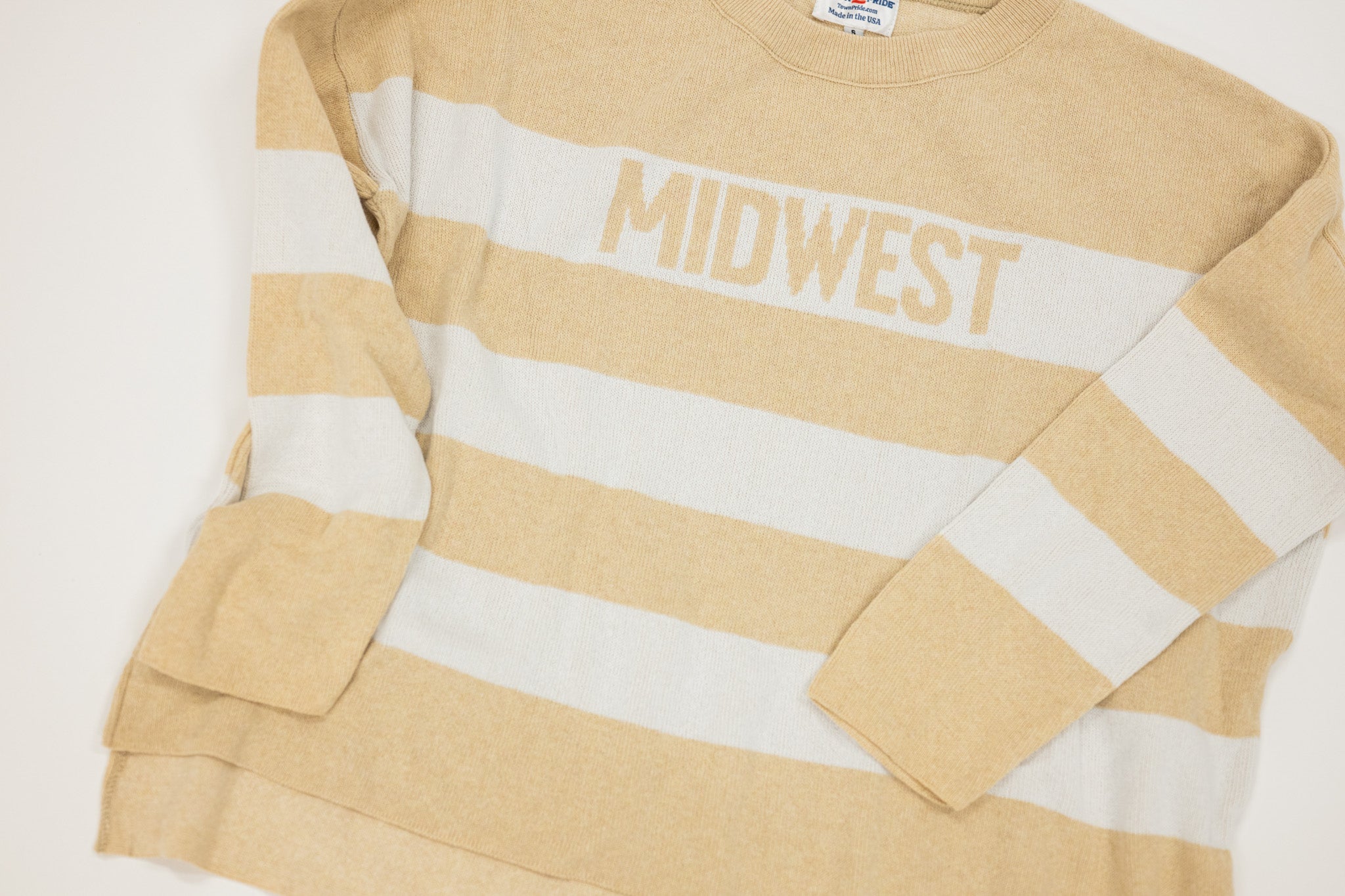 Beige and white striped shirt with 'MIDWEST' text on a light gray background
