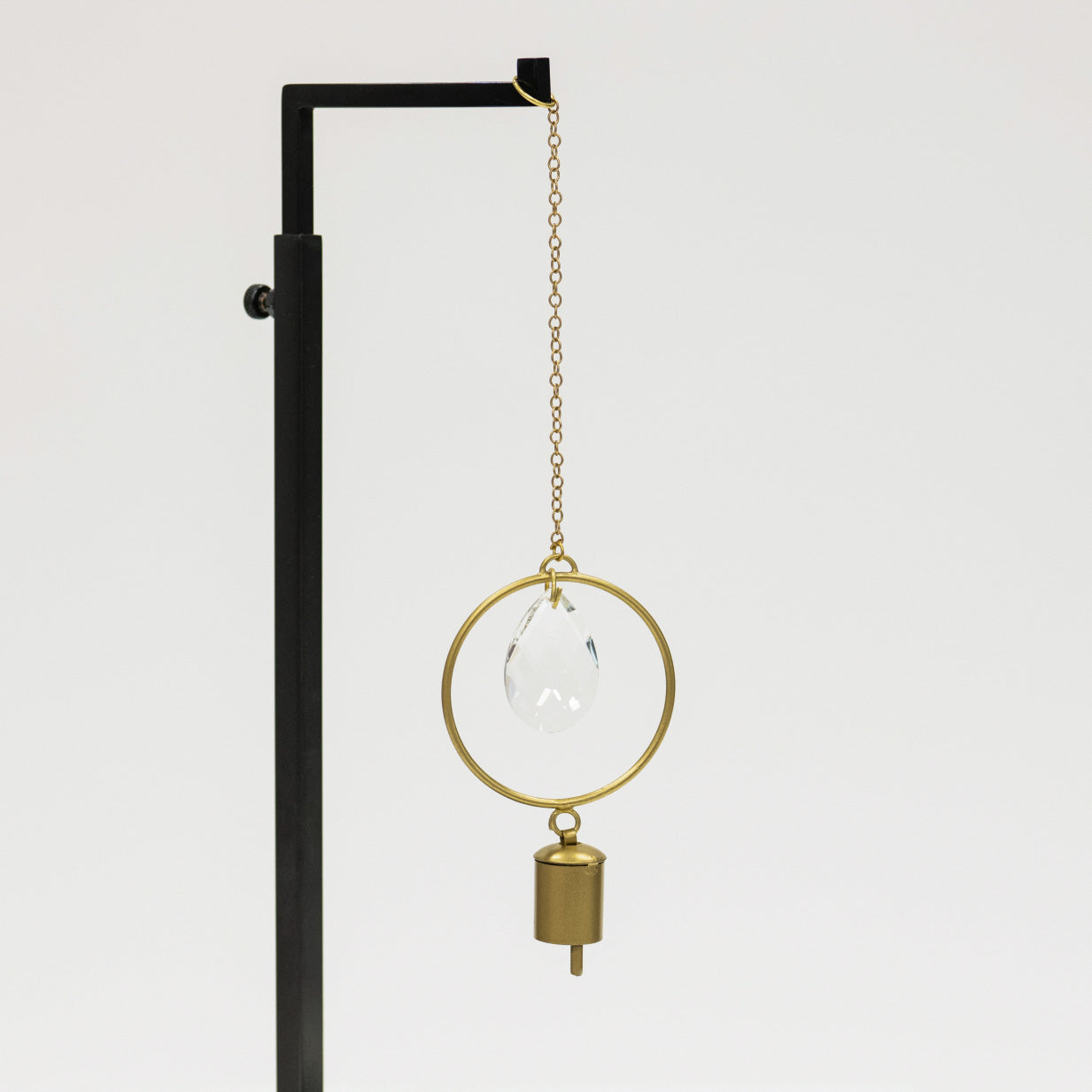 Decorative hanging lamp with clear glass shade and gold accents on a white background