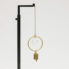 Decorative hanging lamp with clear glass shade and gold accents on a white background