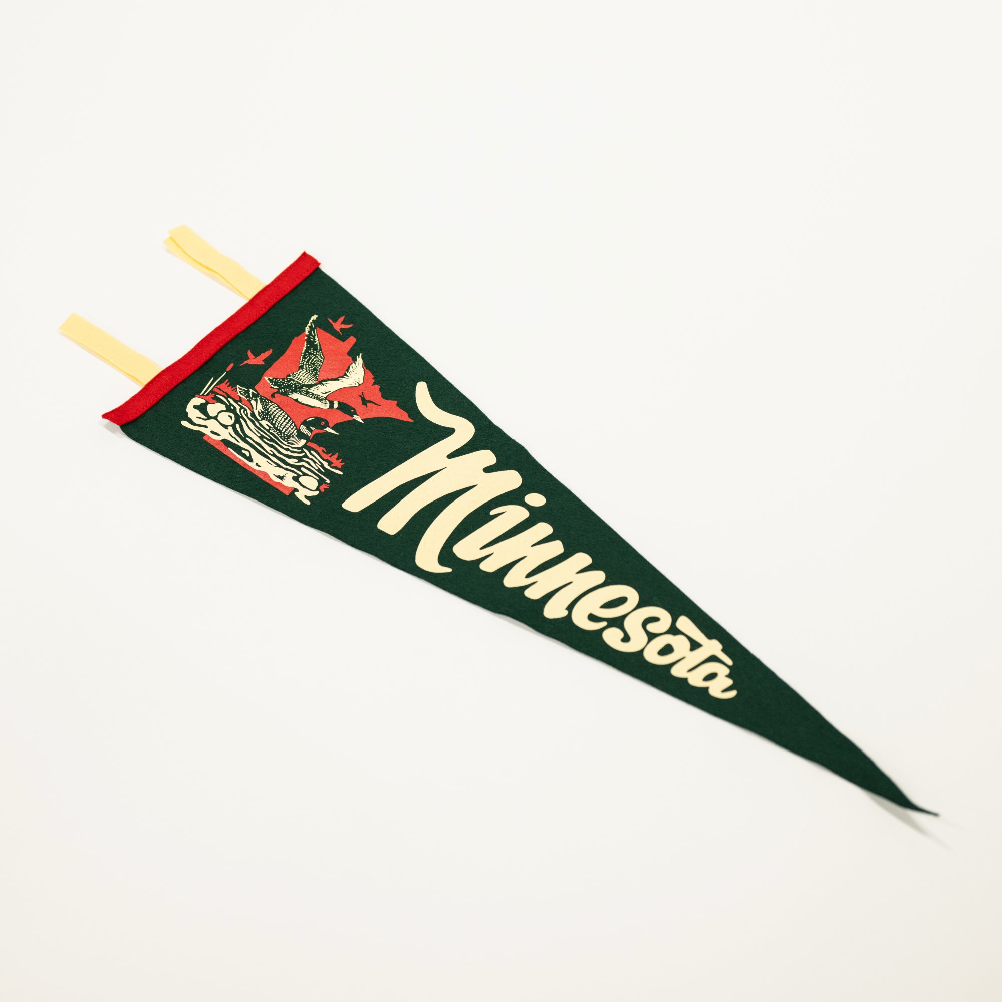 green felt pennant with phrase minnesota