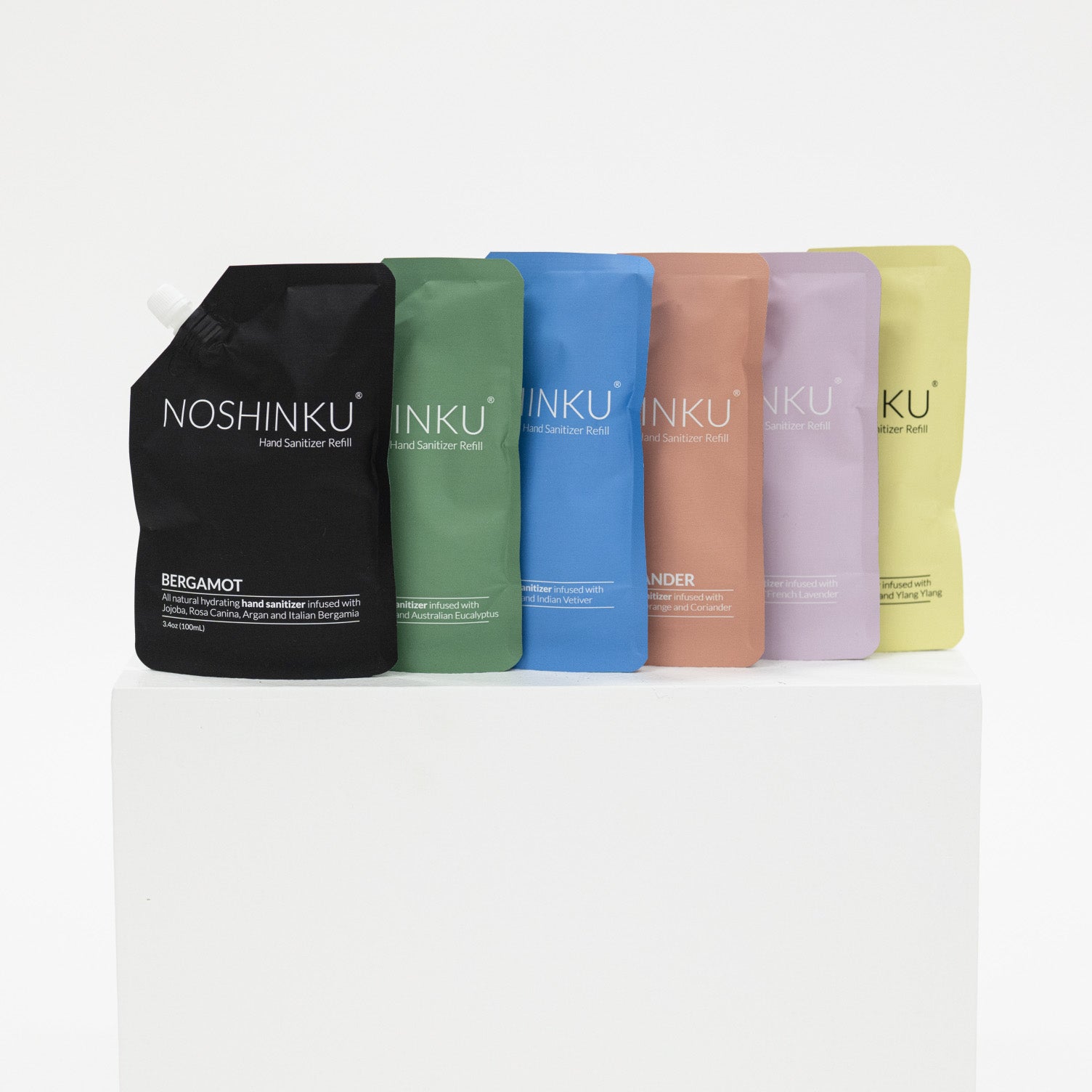 Set of Noshinku hand sanitizer refill bottles in various colors on a white background