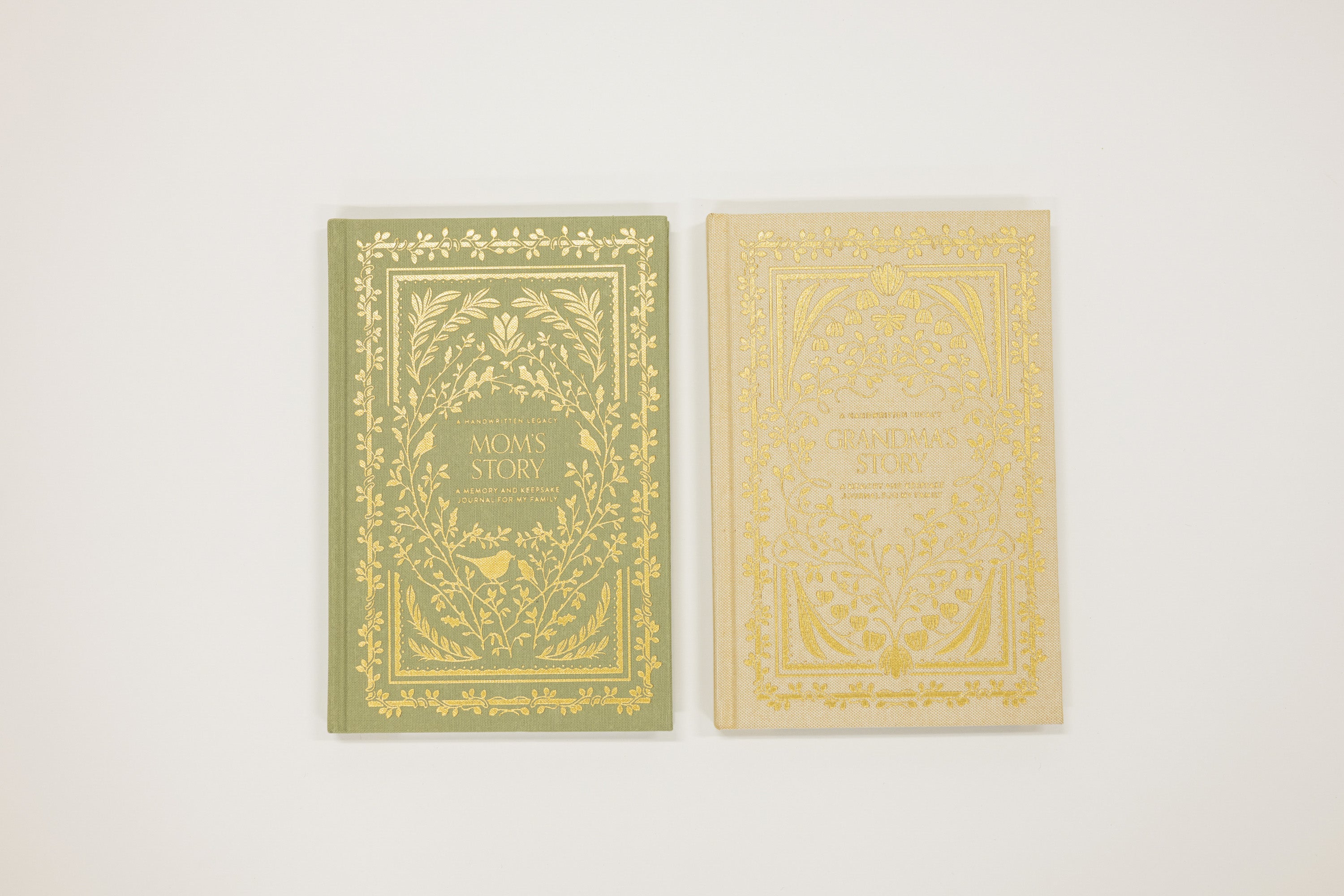 Two books with ornate covers on a white background
