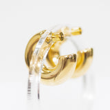 Gold hoop earrings on a white background