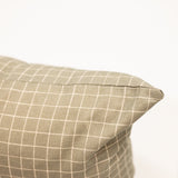 moss green with grid pattern on a long lumbar pillow