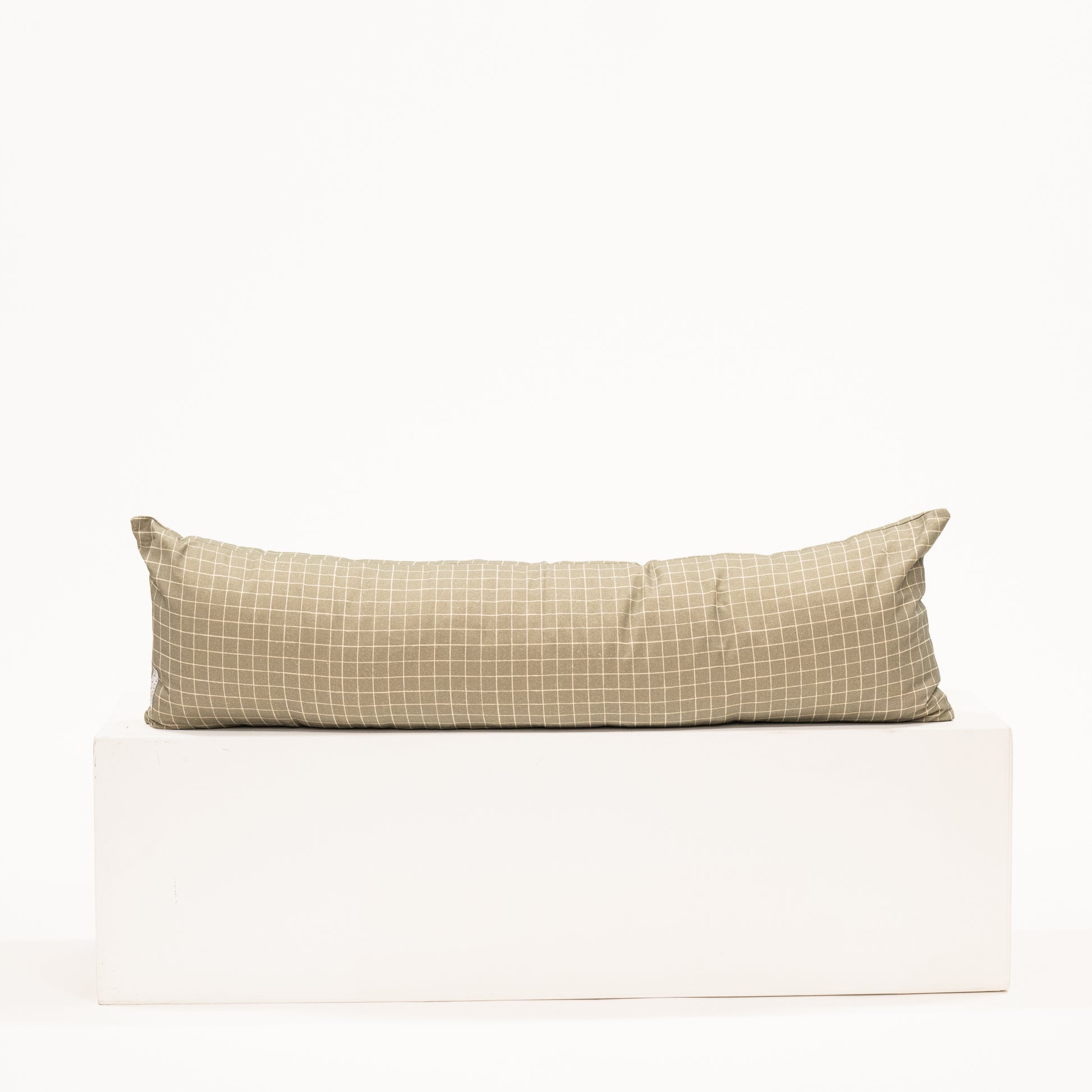 moss green with grid pattern on a long lumbar pillow