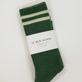 Green socks with white stripes on a white background, featuring 'Le Bon Shoppe' label.