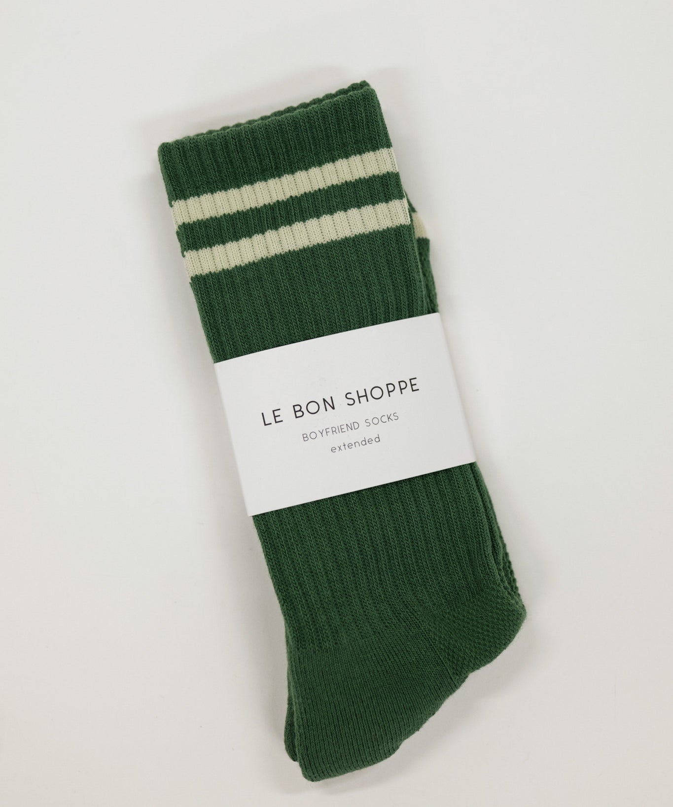 Green socks with white stripes on a white background, featuring 'Le Bon Shoppe' label.