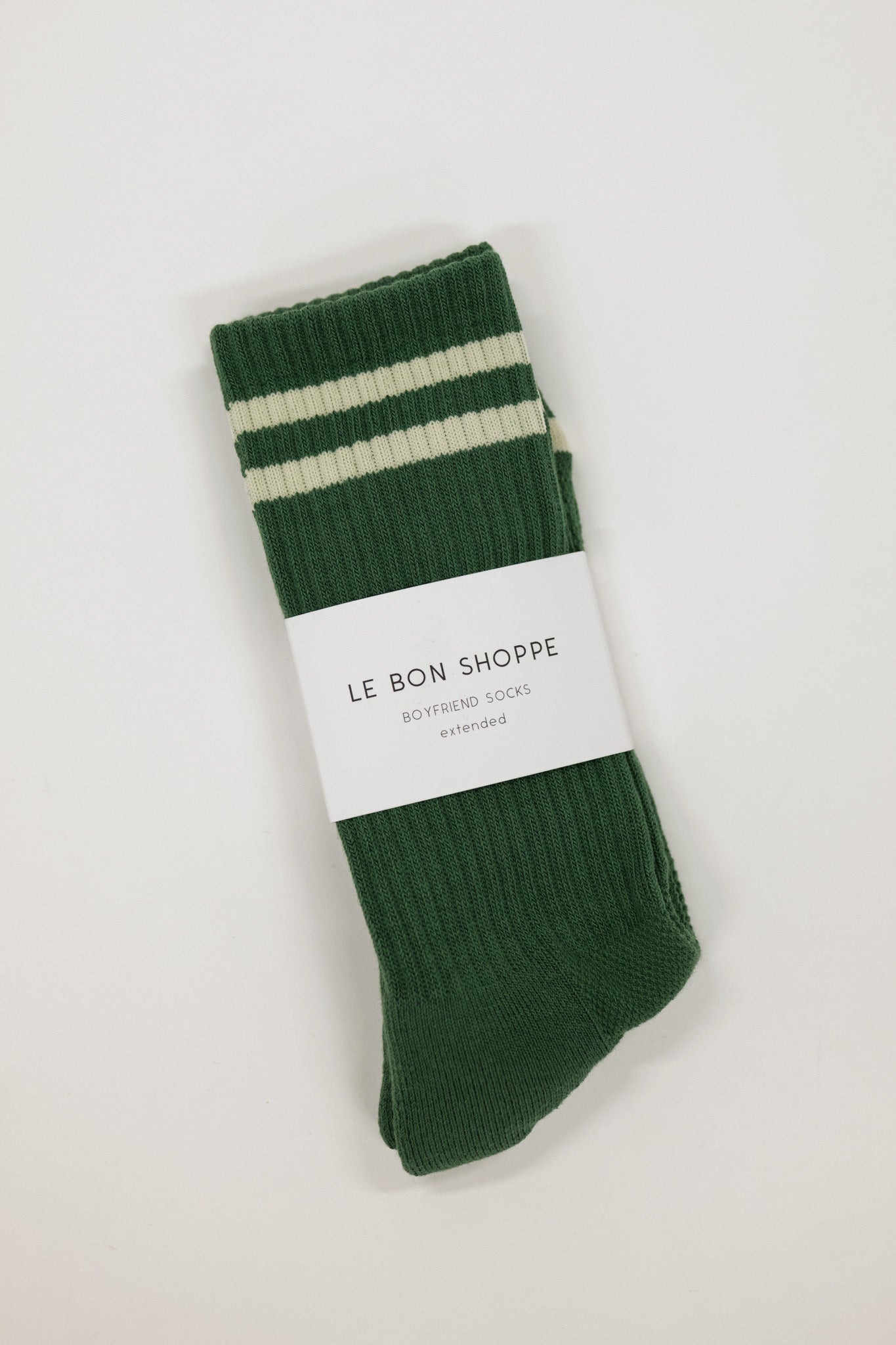 Green socks with white stripes on a white background, featuring 'Le Bon Shoppe' label.