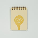 Notebook with a yellow chick wearing glasses design on a light gray background
