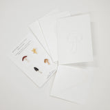 Set of 8 watercolor paintable notecards with envelopes. Feature mushroom patterns.