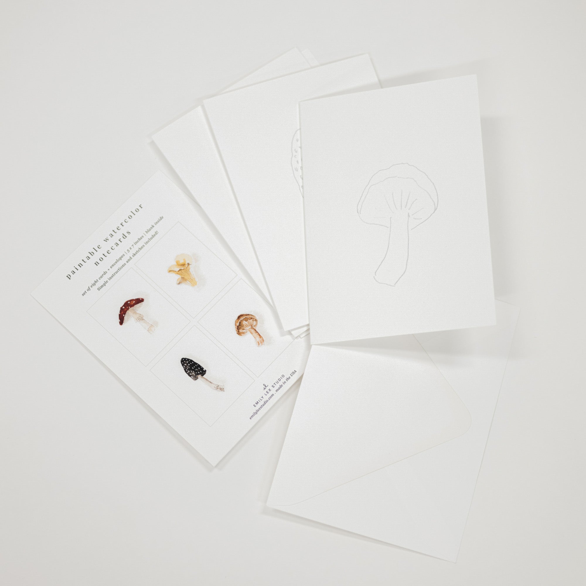 Set of 8 watercolor paintable notecards with envelopes. Feature mushroom patterns.