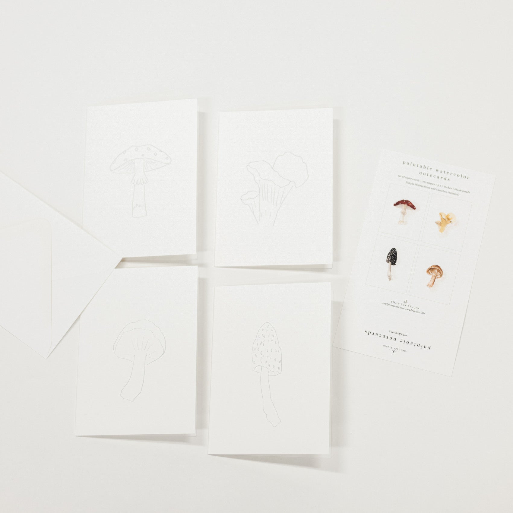 Set of 8 watercolor paintable notecards with envelopes. Feature mushroom patterns.