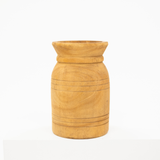A small cylindrical wooden vase with a flared rim and carved horizontal grooves, shown on a white background.